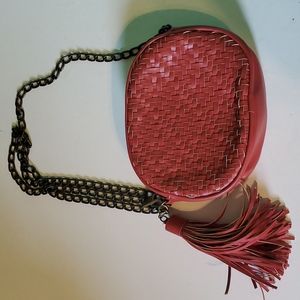 Anthropologie small round maroon woven shoulder purse with side tassel